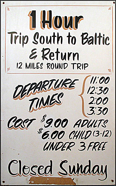 Age of Steam Roundhouse Pricing sign for the steam engine trips Jerry Jacobson ran from 1989 to 2003.