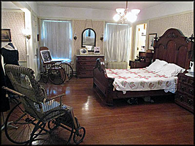 The Hickories' Master Bedroom. The wheelchairs were built by Worthington Manufacturing, a company owned by Arthur Garford that is now known as Invacare