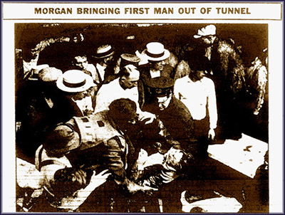 Photo of Garrett Morgan bringing the first man he rescued out of the tunnel.