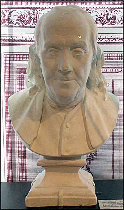 Benjamin Franklin Museum The bust of Ben Franklin is a plaster copy of a sculpture by Jean-Antoine Houdon. This example is attributed to the Florentine Art Plaster Company.